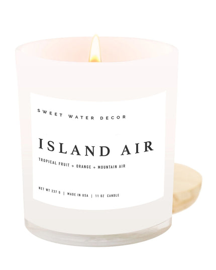 Candle labeled 'Island Air' by Sweet Water Decor on a white background