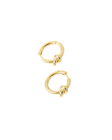 A pair of small gold huggie hoop earrings with a knotted detail at the front, shown on a plain white background.