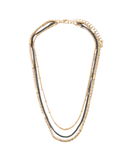 A multi-strand necklace featuring gold-toned chains, a central dark gray chain, and small clear rhinestone accents, displayed on a solid white background.