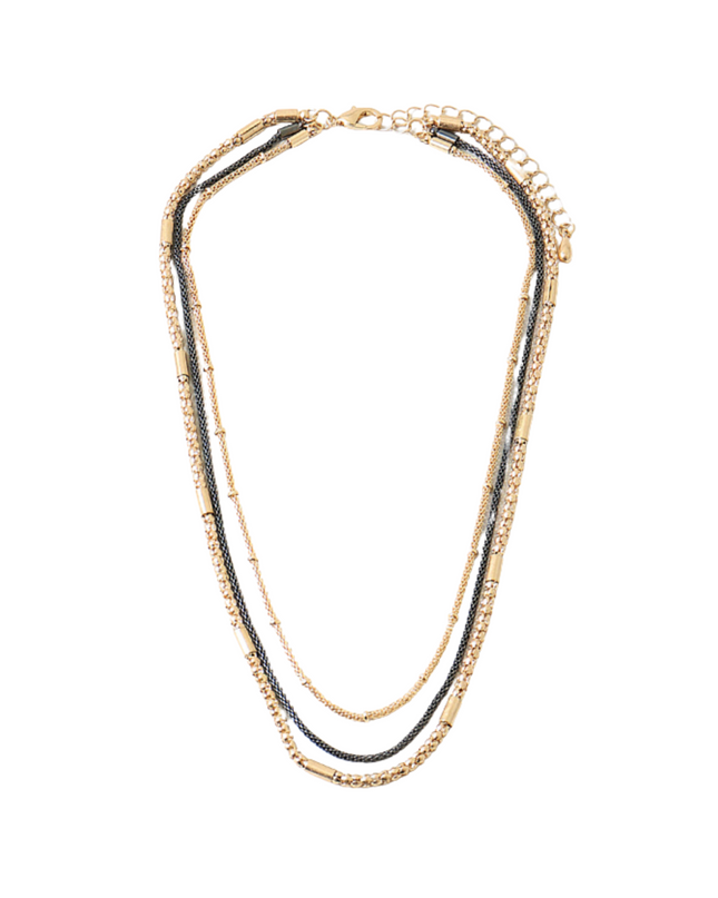 A multi-strand necklace featuring gold-toned chains, a central dark gray chain, and small clear rhinestone accents, displayed on a solid white background.
