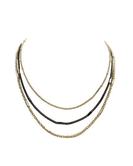 A layered necklace set featuring three distinct chains: a gold chain with cylindrical links, a gold chain with textured beads, and a dark brown chain wrapped with black cord, displayed against a solid white background.