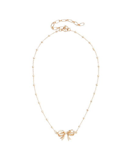 A delicate gold chain necklace featuring a small bow-shaped pendant at the center, displayed on a clean white background.