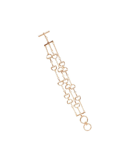 A delicate rose gold chain bracelet with interlocking heart motifs, a T-bar clasp, and two hanging rings at the bottom, displayed on a clean white background.