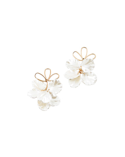 A pair of gold and white flower-shaped stud earrings on a solid white background.