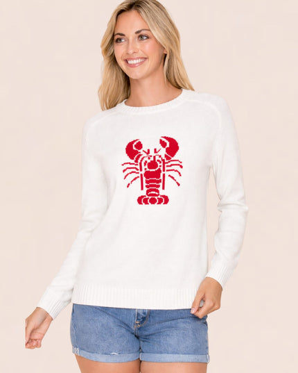 Woman wearing a white long-sleeve shirt with a red lobster design on a beige background
