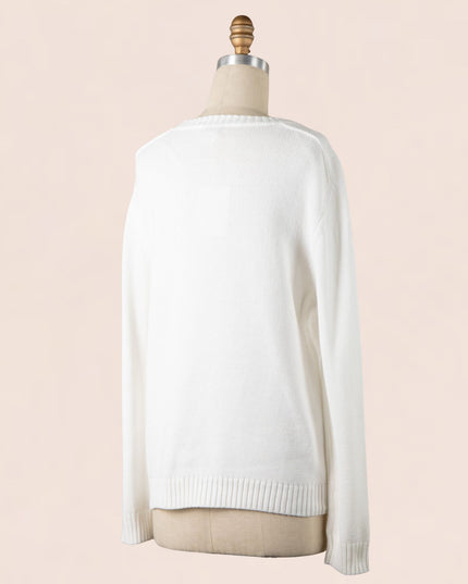 White sweater on a mannequin against a beige background