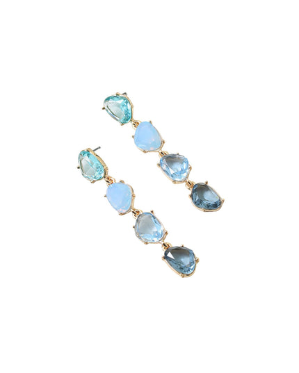 A pair of gold drop earrings featuring a series of teardrop-shaped light blue and dark blue gemstones, displayed on a clean white background.