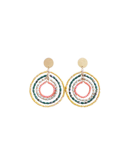 A pair of bohemian-style dangle earrings featuring multiple concentric rings of gold, green, pink, and white beads, suspended from flat gold disc studs, shown on a plain white background.