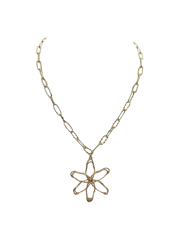 A gold-toned chain necklace featuring a stylized, openwork flower pendant, shown against a plain white background.
