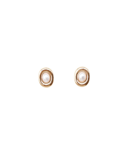 A pair of gold-toned oval stud earrings with a white pearl-like center, shown on a plain white background.