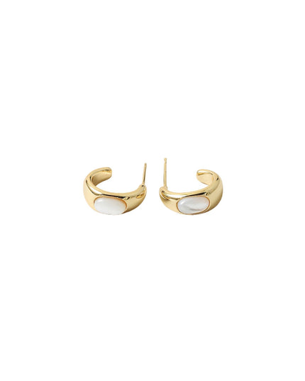 A pair of gold crescent-shaped hoop earrings with a smooth white oval inlay, shown on a plain white background.