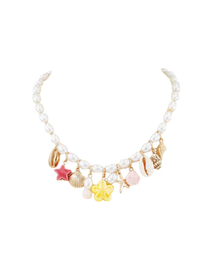 A pearl beaded necklace with various small charms including starfish, seashells, a yellow flower, and a pink star, displayed on a solid white background.
