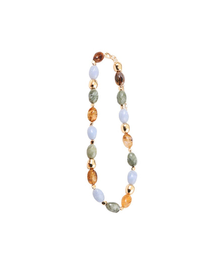 A beaded necklace featuring faceted gemstone beads in light blue, olive green, amber orange, and dark brown, separated by small gold spacer beads, displayed on a solid white background.