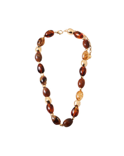 A beaded necklace featuring polished amber brown and translucent golden beads separated by small gold spacer beads, displayed on a clean white background.