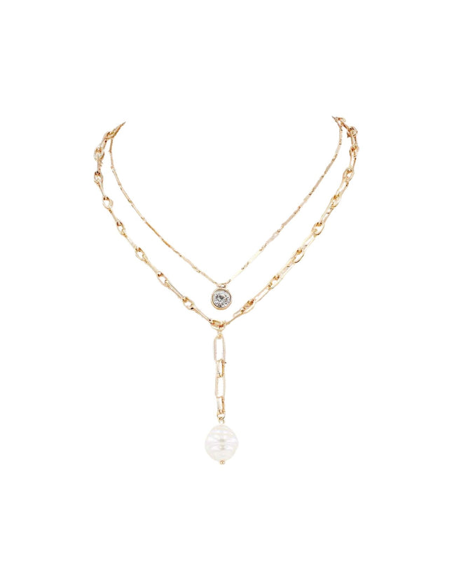A delicate gold-toned double-layer necklace featuring a small round silver-toned medallion on one layer and a larger paperclip link leading to a faceted white pearl pendant on the other, displayed on a clean white background.