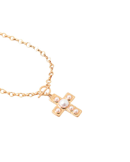 A gold chain necklace with a cross pendant featuring a central white pearl and smaller pearl-like accents, shown on a plain white background.