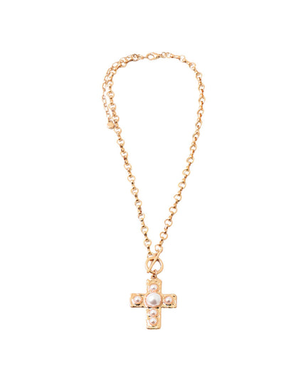 A delicate gold chain necklace featuring a small cross pendant adorned with a central white pearl and small clear rhinestones, set against a plain white background.