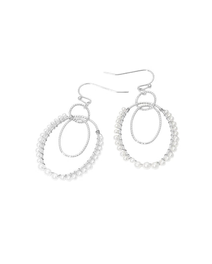 Pair of silver hoop earrings on a white background