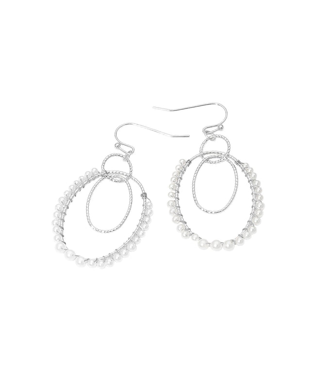 Pair of silver hoop earrings on a white background