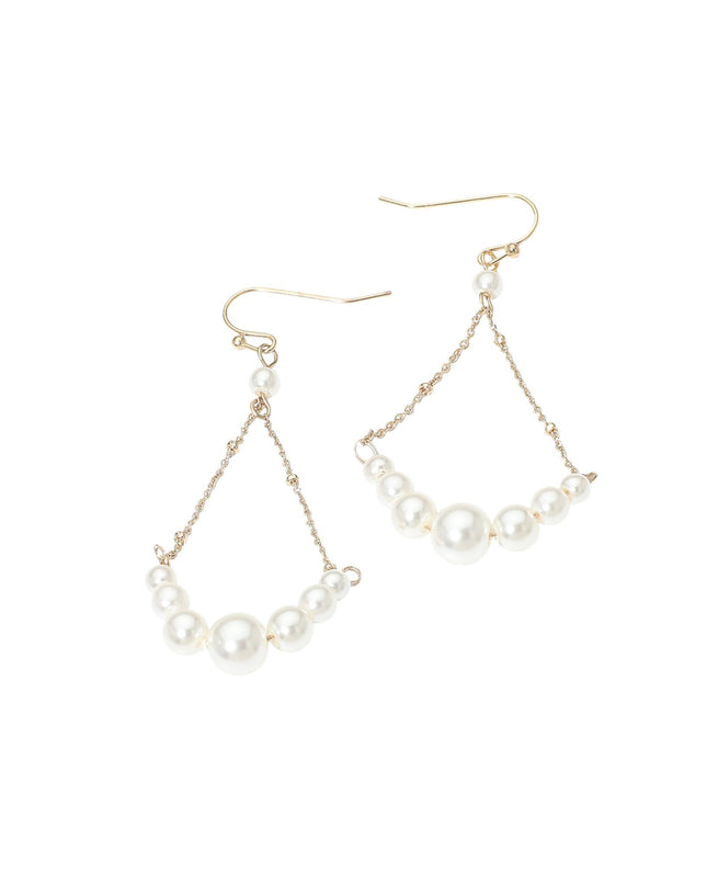 Pair of pearl drop earrings on a white background