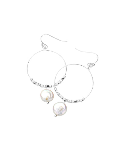Silver hoop earrings with pearl drops on a white background