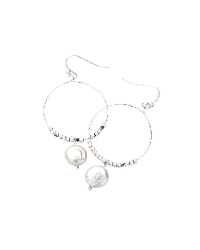 Silver hoop earrings with pearl drops on a white background