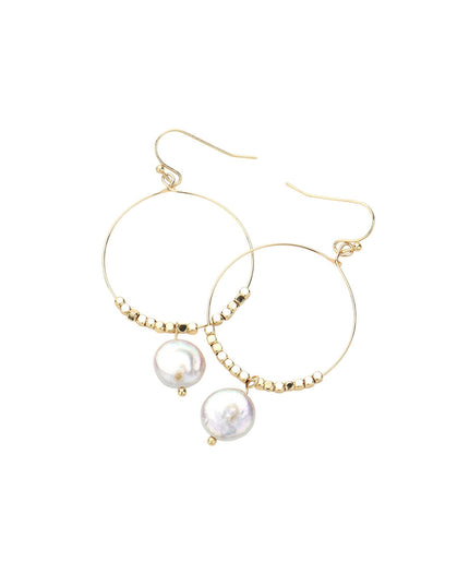 Gold hoop earrings with pearl drops on a white background