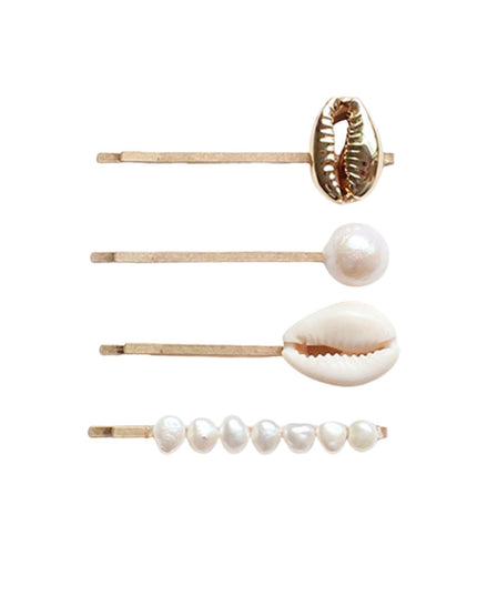 Four gold-tone bobby pins arranged vertically on a white background, featuring a cowrie shell, a pearl, a larger cowrie shell, and a row of small pearls.