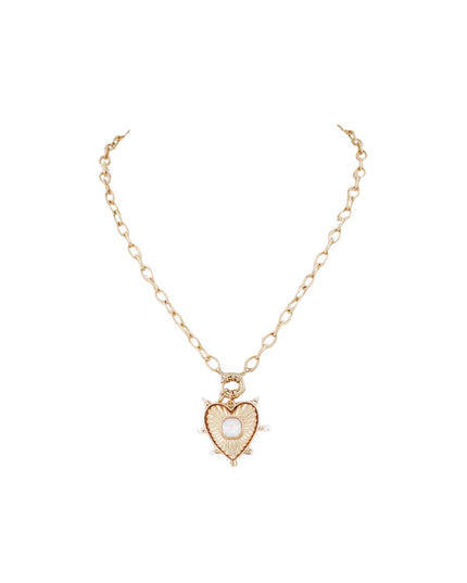 A delicate gold chain necklace featuring a heart-shaped pendant with a central white pearl and small clear rhinestone accents, displayed on a clean white background.
