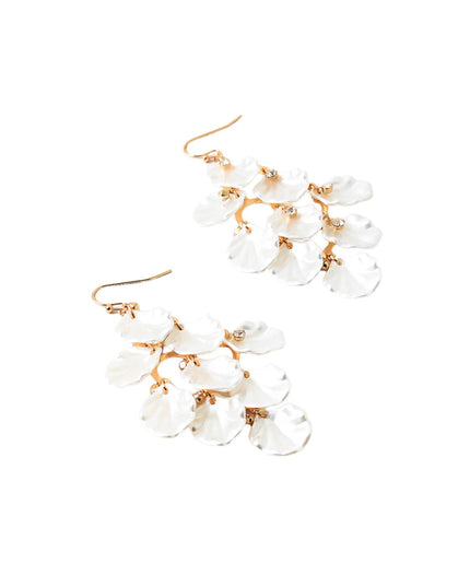 A pair of gold-tone drop earrings featuring a cluster of white, petal-shaped glass beads on a clean white background.