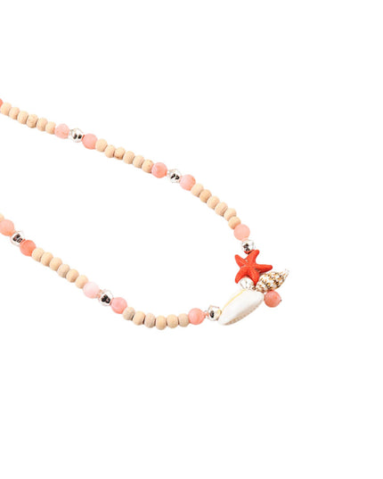 A beaded necklace featuring natural wood beads, pink and peach beads, small silver spacer beads, a white seashell, and a red-orange starfish charm, displayed on a solid white background.