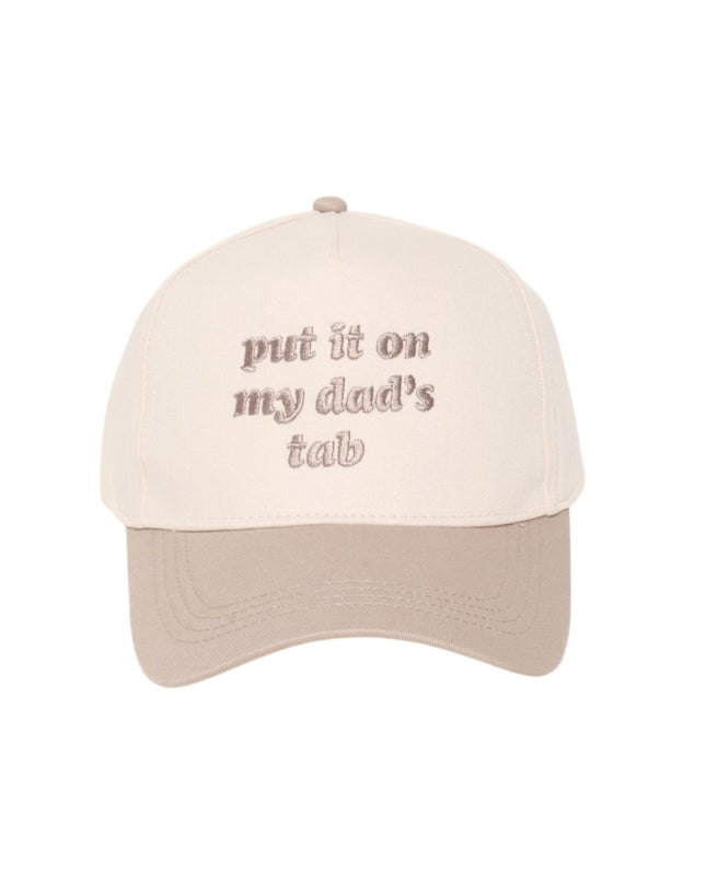 Beige cap with text 'put it on my dad's tab' on a white background