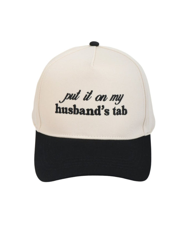 Beige and black cap with text 'put it on my husband's tab' on a white background