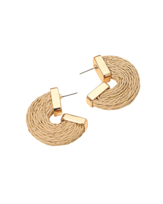Gold hoop earrings on a white background