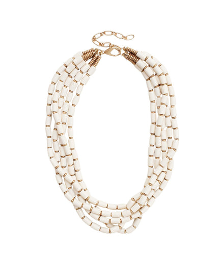 A multi-strand statement necklace featuring cylindrical off-white beads with small gold spacer accents and a gold clasp, shown on a plain white background.