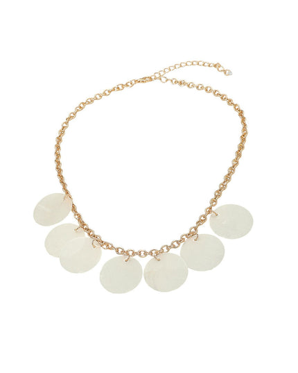 A gold chain necklace featuring seven round, disc-shaped charms in a milky white or pale sage green color, displayed on a clean white background.