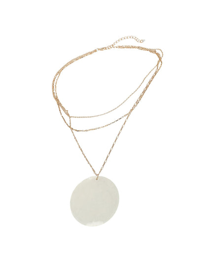 A multi-layered gold chain necklace featuring a large, flat, circular disc pendant, displayed against a solid white background.