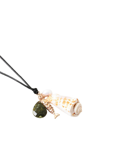 A seashell pendant necklace with a gold-tone fish charm and a dark green teardrop stone, suspended on a black cord against a plain white background.