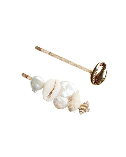 A pair of gold-toned stud earrings featuring natural cowrie shells and baroque pearls on a clean white background.