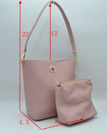 Pink handbag with measurements on a light gray background