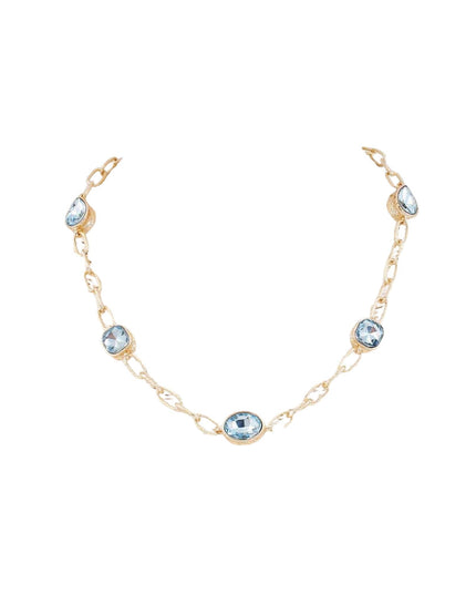 A delicate gold chain bracelet featuring five light blue oval gemstones spaced along the chain, displayed on a clean white background.