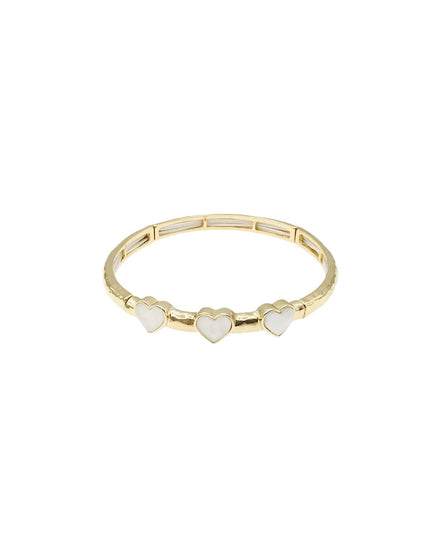 A gold-plated bangle bracelet featuring three small white mother-of-pearl heart charms spaced along the front band, set against a plain white background.