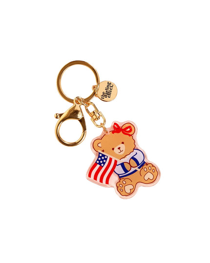 Keychain with bear design wearing an American flag scarf on a white background