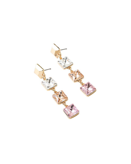 A pair of gold-tone drop earrings featuring a graduated sequence of square-cut rhinestones in silver, rose gold, and pink, set against a plain white background.