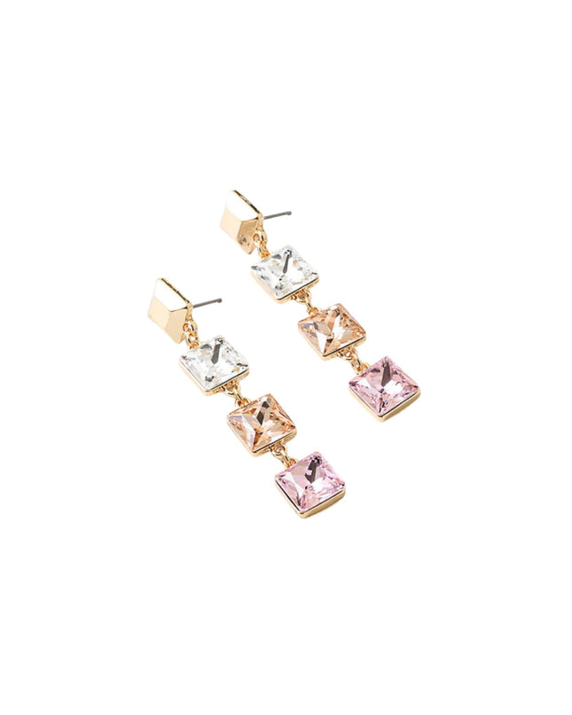 A pair of gold-tone drop earrings featuring a graduated sequence of square-cut rhinestones in silver, rose gold, and pink, set against a plain white background.