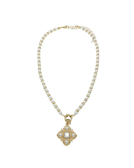 A gold-plated necklace featuring a delicate chain of small white pearls and a central quatrefoil pendant with a square white stone surrounded by small clear crystals, set against a plain white background.