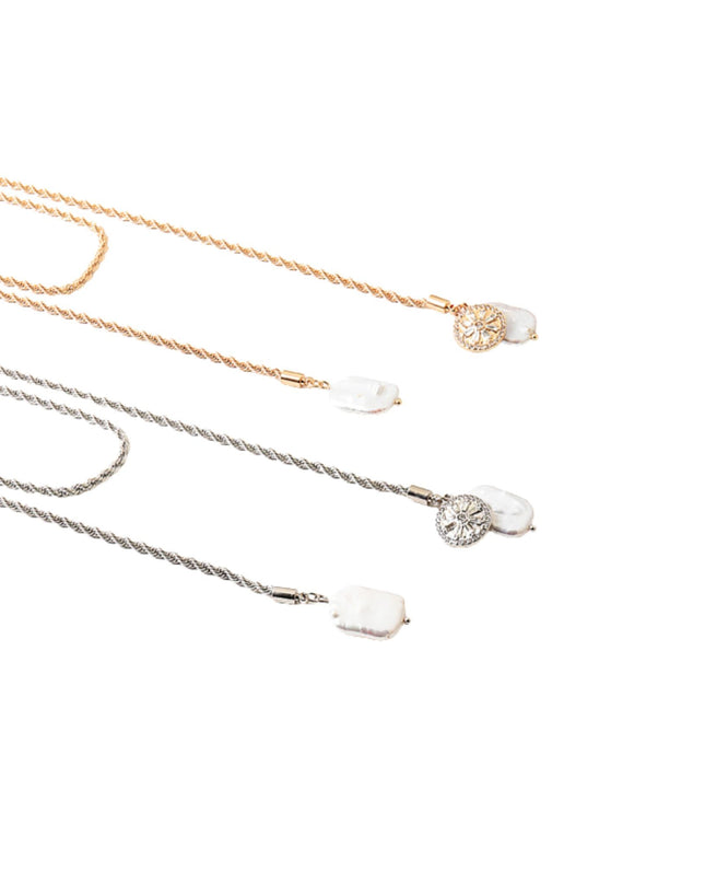 Three delicate rope-chain necklaces with oval white stone pendants, shown in gold, silver, and rose gold tones on a plain white background.