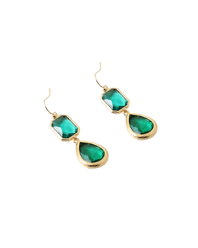Gold earrings with green teardrop-shaped stones on a white background