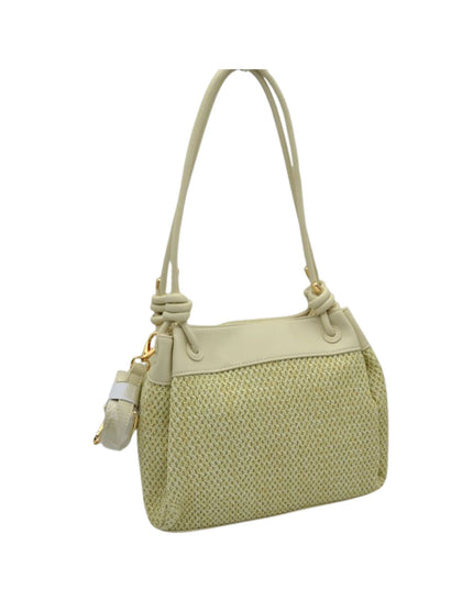 Light green handbag with a textured pattern on a white background
