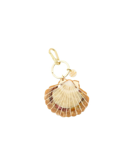 A gold-toned shell charm featuring a realistic scallop shell pendant with a small gold ring and lobster clasp at the top, shown on a plain white background.